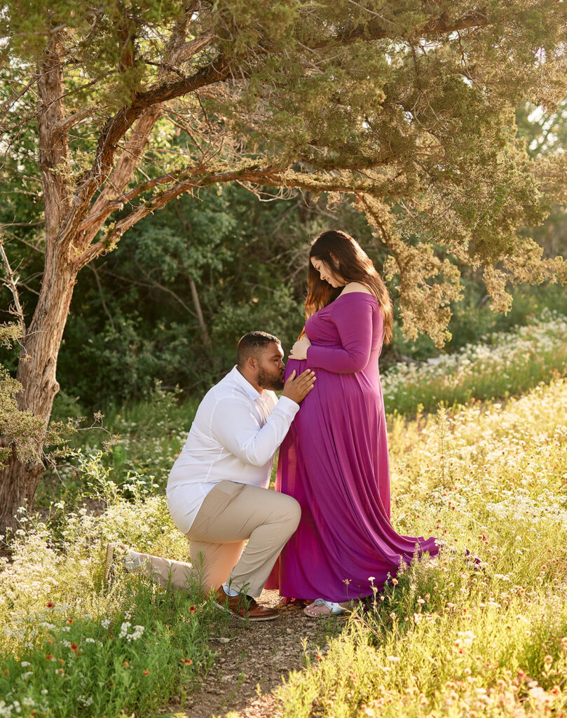 Dallas maternity photography where husband kisses wife's belly